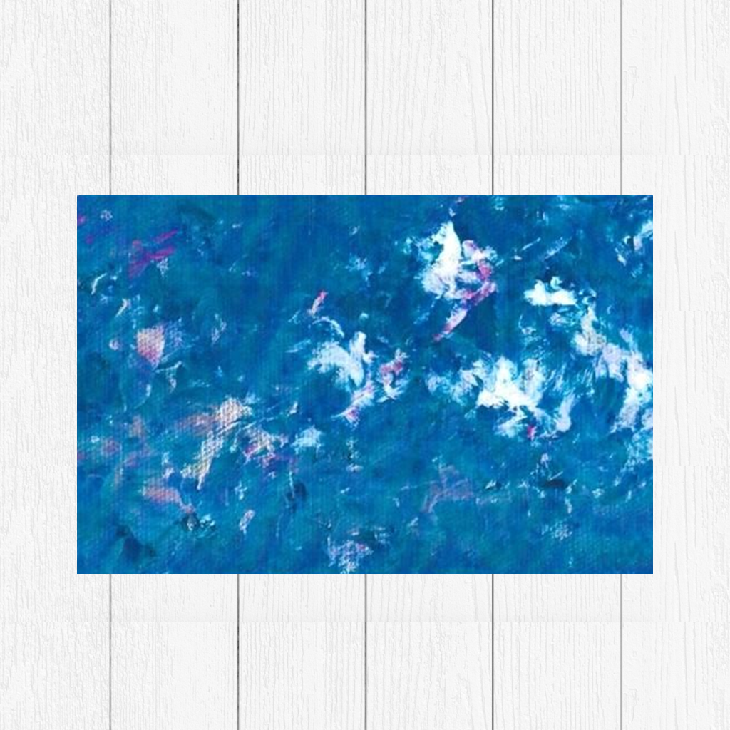 Abstract canvas art featuring textured shades of blue with hints of white and pink, resembling ocean waves or a cloudy sky, set against a Scandinavian white background."

