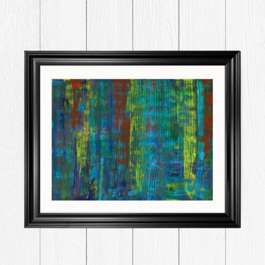 Abstract artwork featuring a mix of vibrant colors, including blue, green, yellow, and red, with vertical textured patterns, in a black frame hanging up against a Scandinavian white background.

